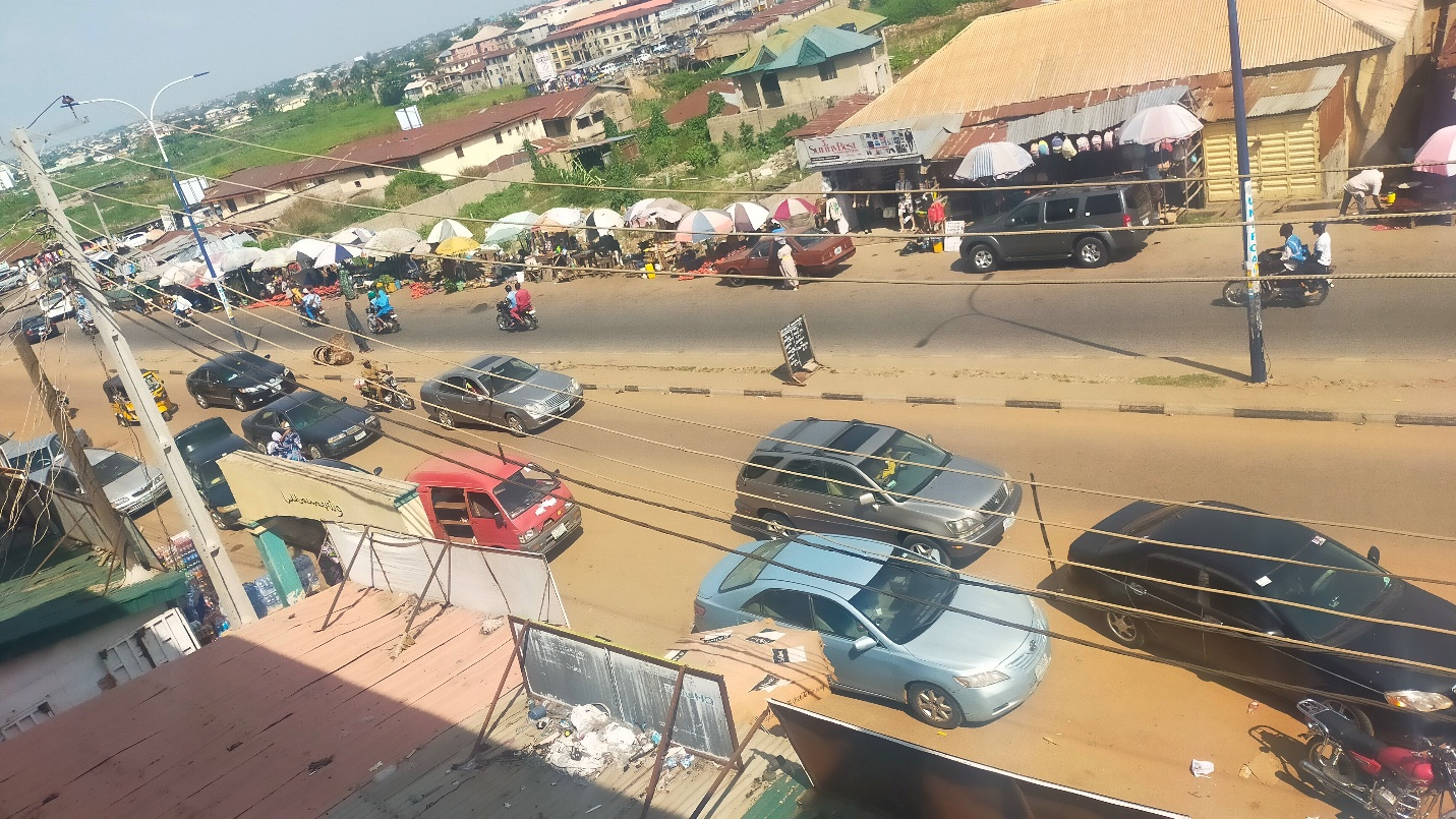 Roadside friction at Section A: market and vendor activity.